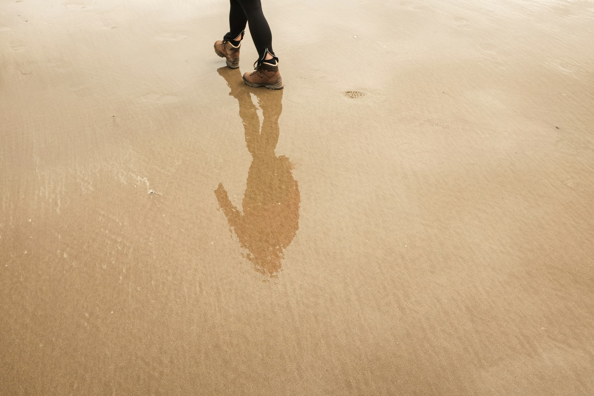 a person walking on the beach